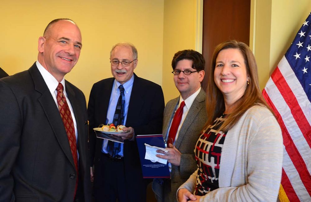 David Boelzner and Daniel Krasnegor (second and third from left) of Goodman Allen Donnelly’s Veterans Practice Team at the reception, with members of the Court’s central legal staff.