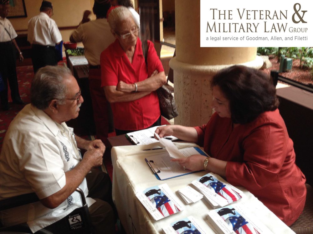 Nancy Foti (on the right) providing assistance to a veteran during the conference in Puerto Rico.